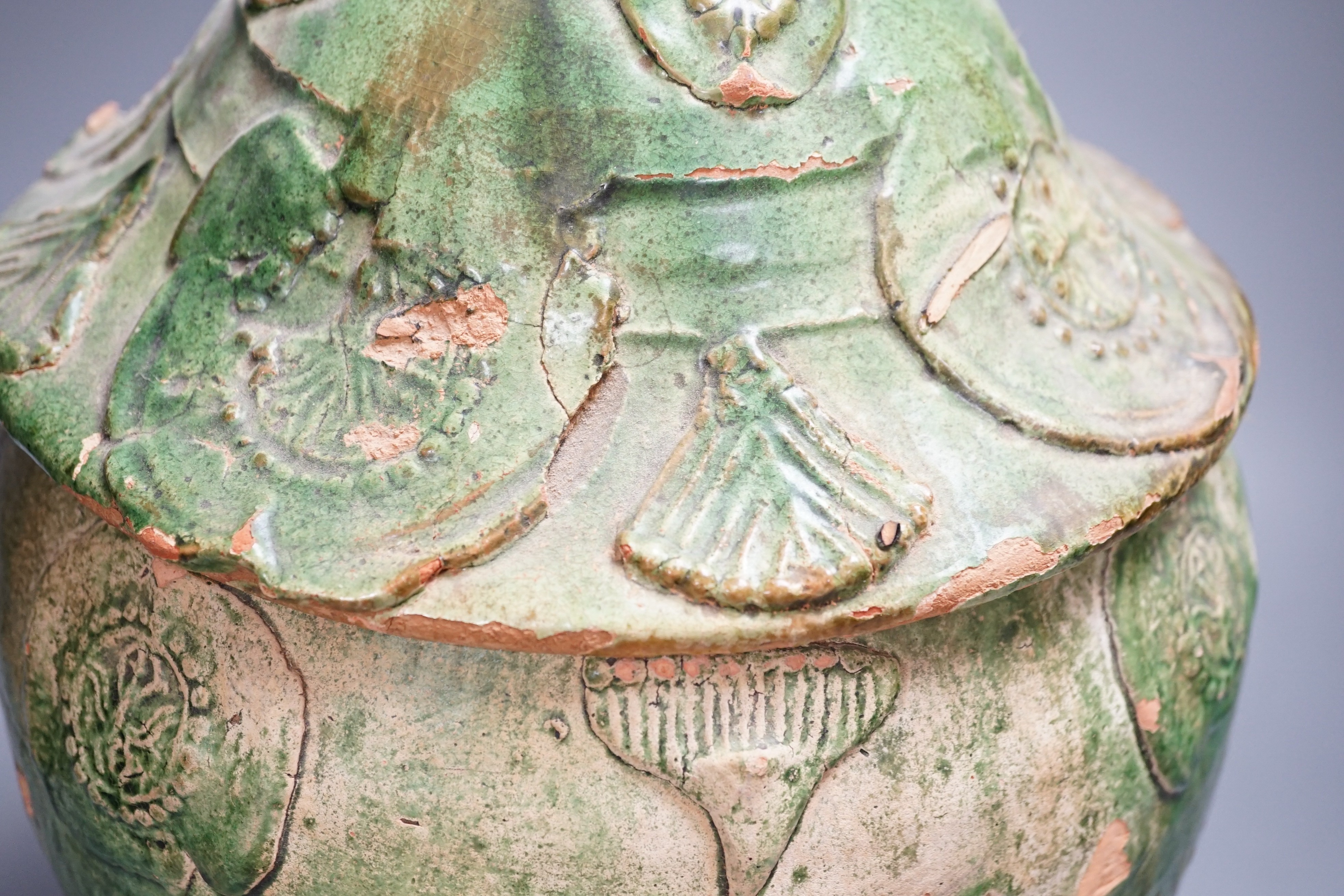 A large Chinese green glazed jar and cover, Liao dynasty, 35cm high